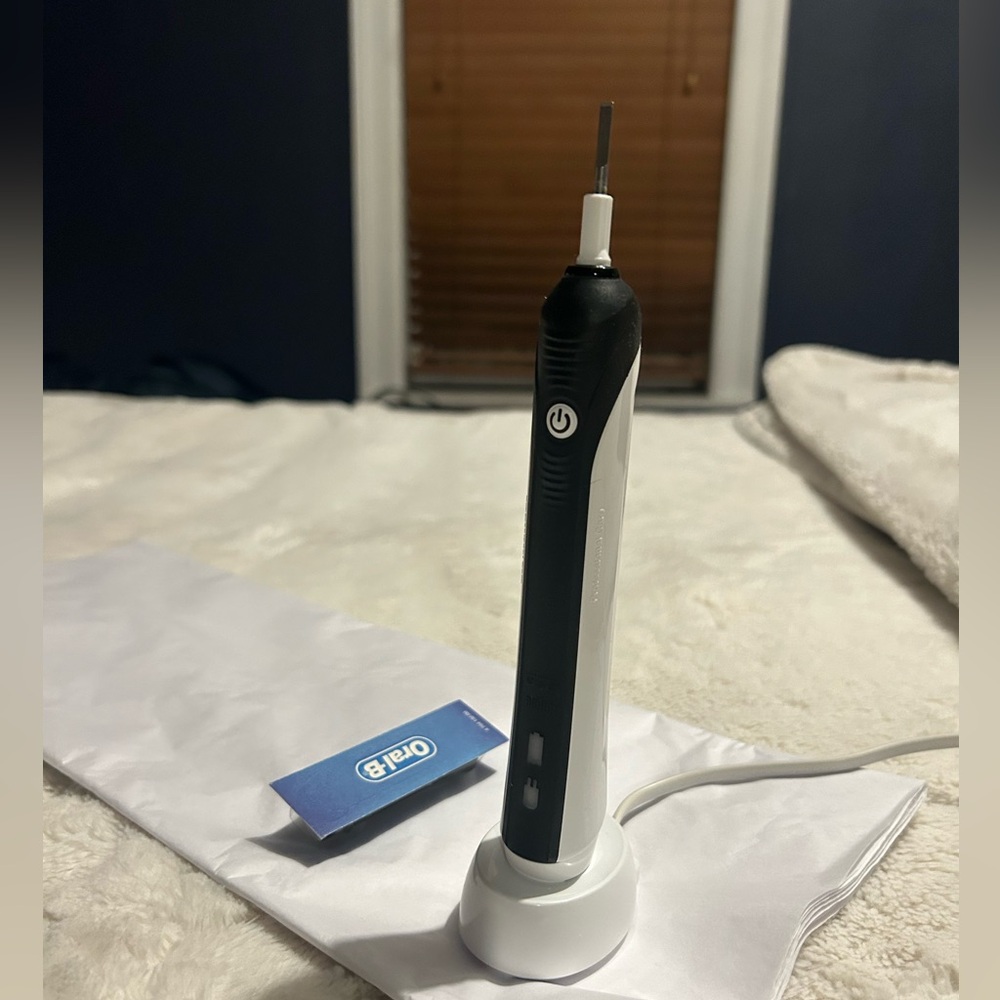 Oral B Pro 1000 Cross Action Toothbrush by Braun.